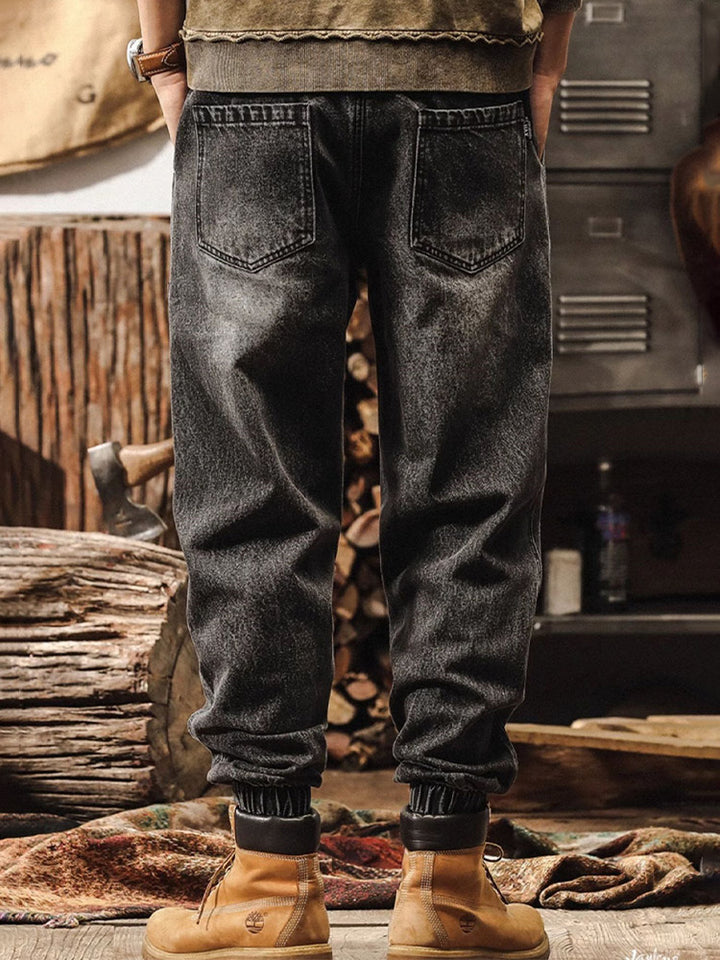 Herrenjeans mit weitem Bein, Vintage-Waschung und elastischen Beinabschlüssen