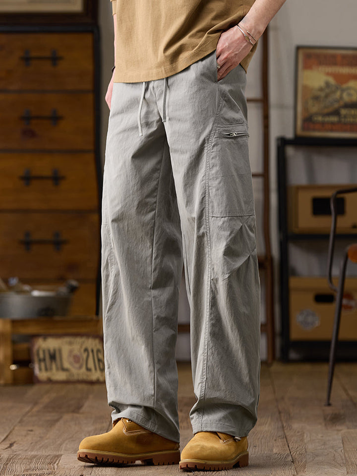 Pantalones cargo de pierna ancha para hombre con múltiples bolsillos y cremallera