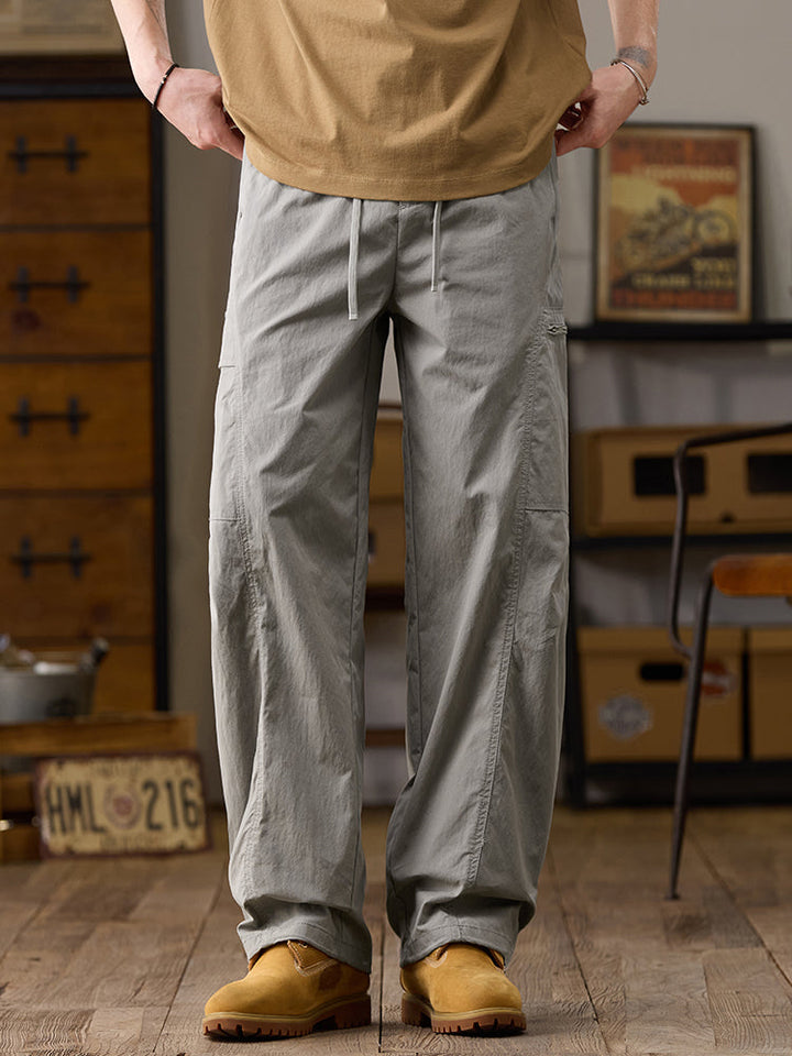 Pantalones cargo de pierna ancha para hombre con múltiples bolsillos y cremallera