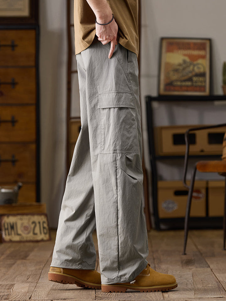 Pantalones cargo de pierna ancha para hombre con múltiples bolsillos y cremallera