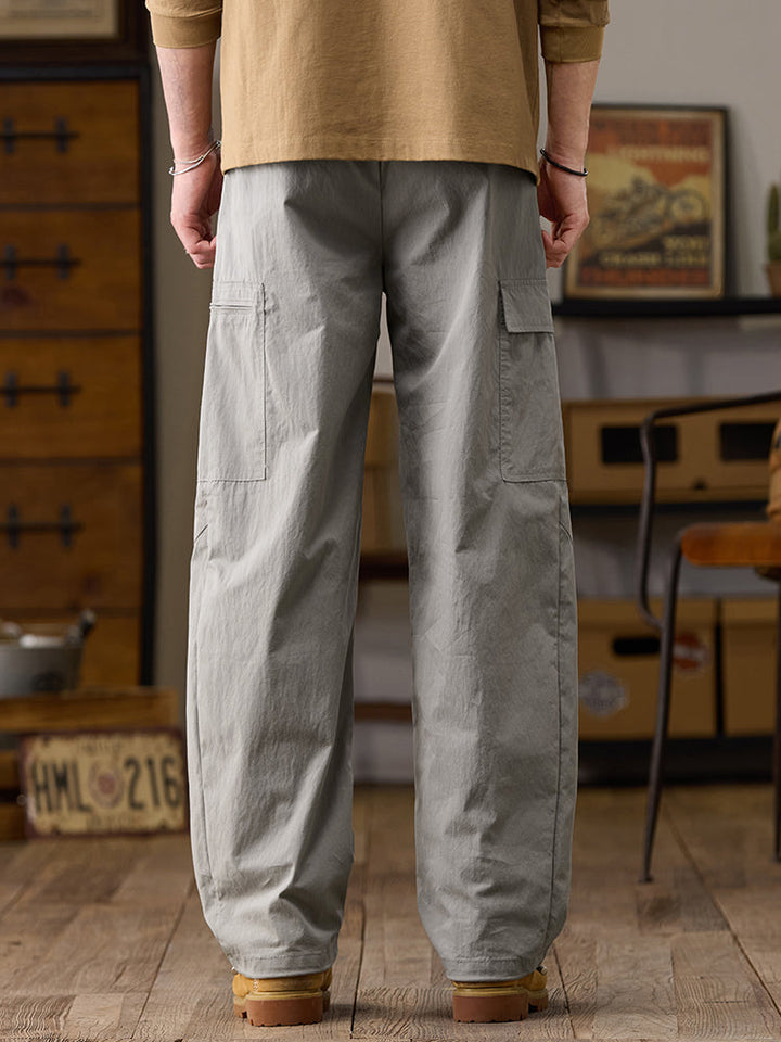 Pantalones cargo de pierna ancha para hombre con múltiples bolsillos y cremallera