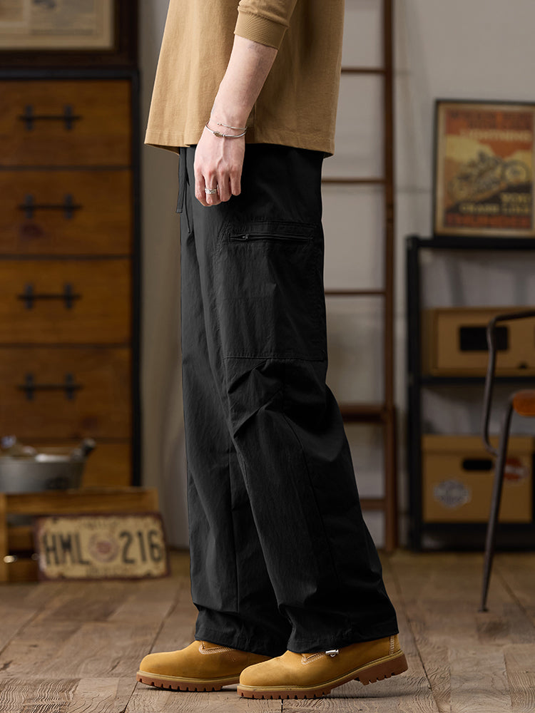 Pantalones cargo de pierna ancha para hombre con múltiples bolsillos y cremallera