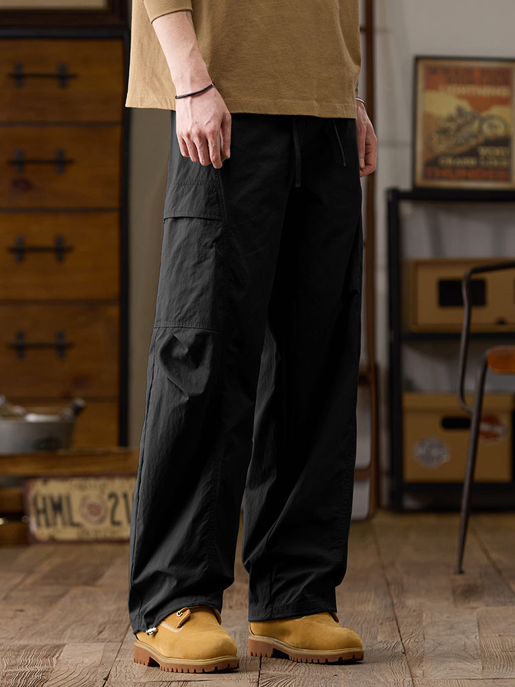 Pantalones cargo de pierna ancha para hombre con múltiples bolsillos y cremallera