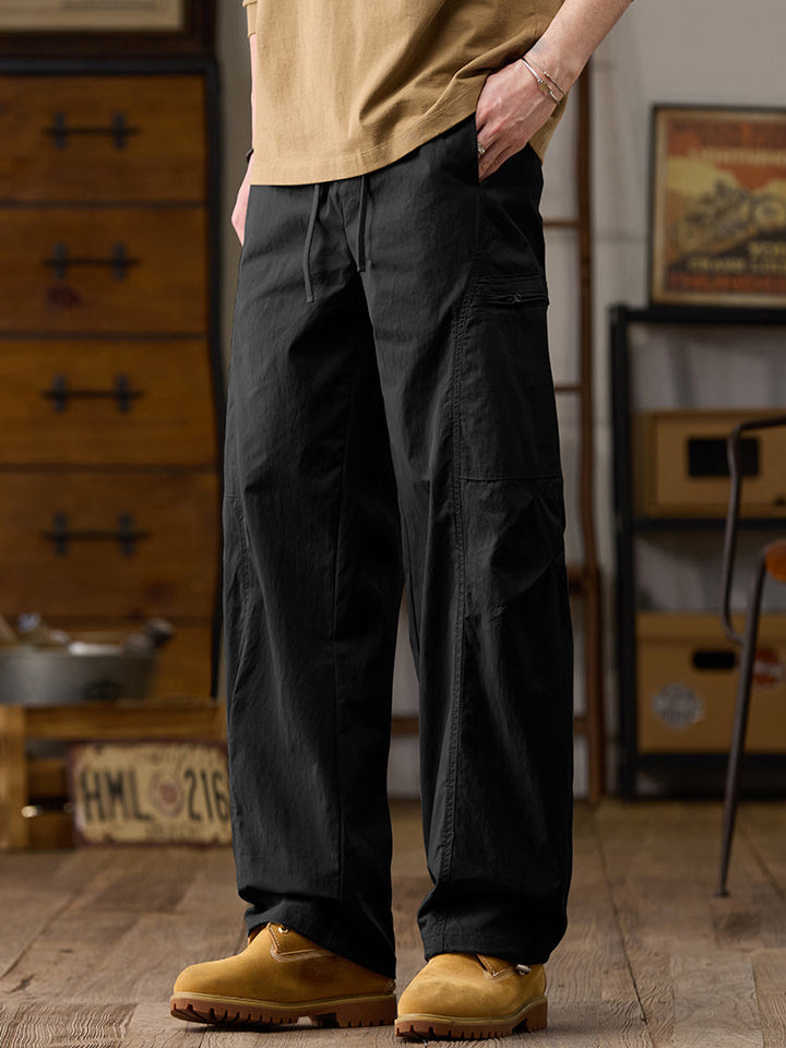 Pantalones cargo de pierna ancha para hombre con múltiples bolsillos y cremallera
