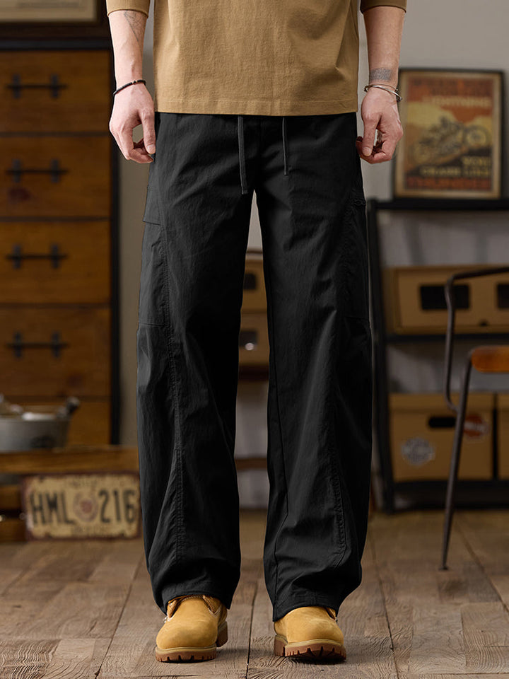 Pantalones cargo de pierna ancha para hombre con múltiples bolsillos y cremallera